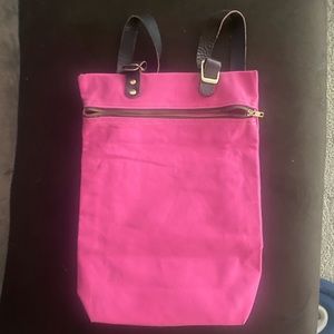 Pink backpack with leather straps